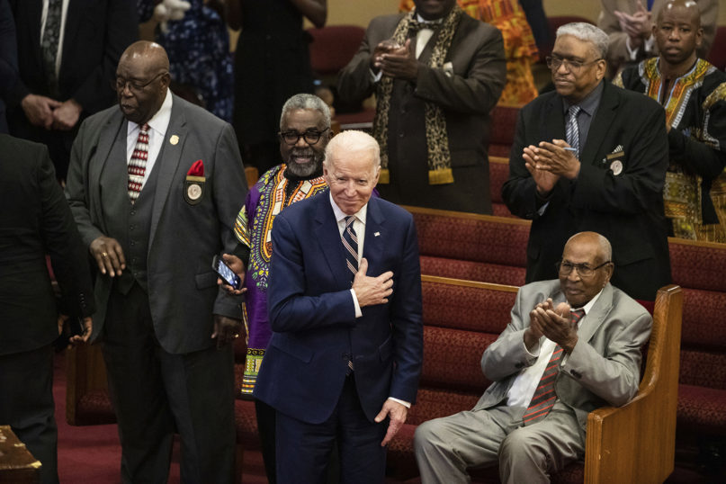In this Feb. 23, 2020, file photo, Democratic presidential candidate and former Vice President Joe Biden acknowledges applause from churchgoers as he departs after attending services at the Royal Missionary Baptist Church in North Charleston, South Carolina. Democrats are betting on Biden’s evident comfort with faith as a powerful point of contrast in his battle against President Donald Trump. (AP Photo/Matt Rourke, File)