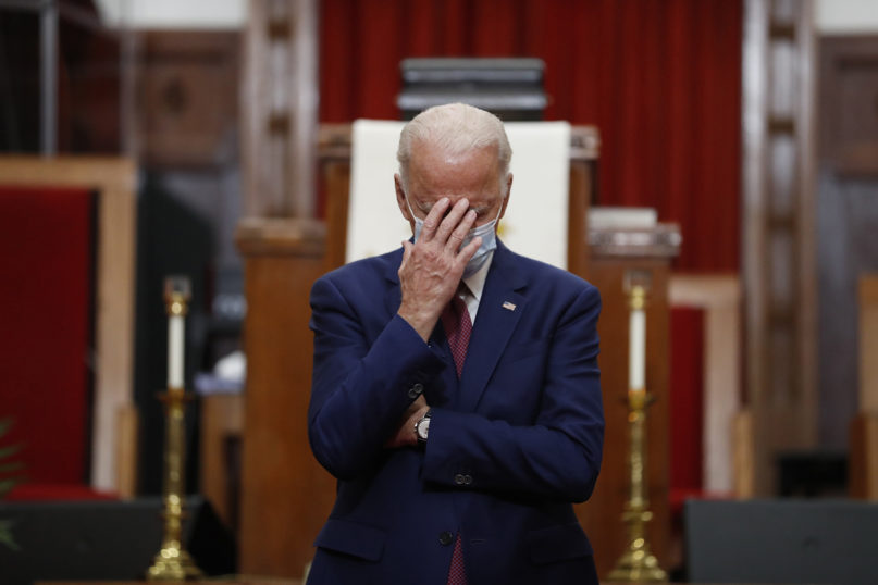 In this June 1, 2020, file photo, Democratic presidential candidate and former Vice President Joe Biden touches his face as he speaks to members of the clergy and community leaders at Bethel AME Church in Wilmington, Delaware. (AP Photo/Andrew Harnik, File)