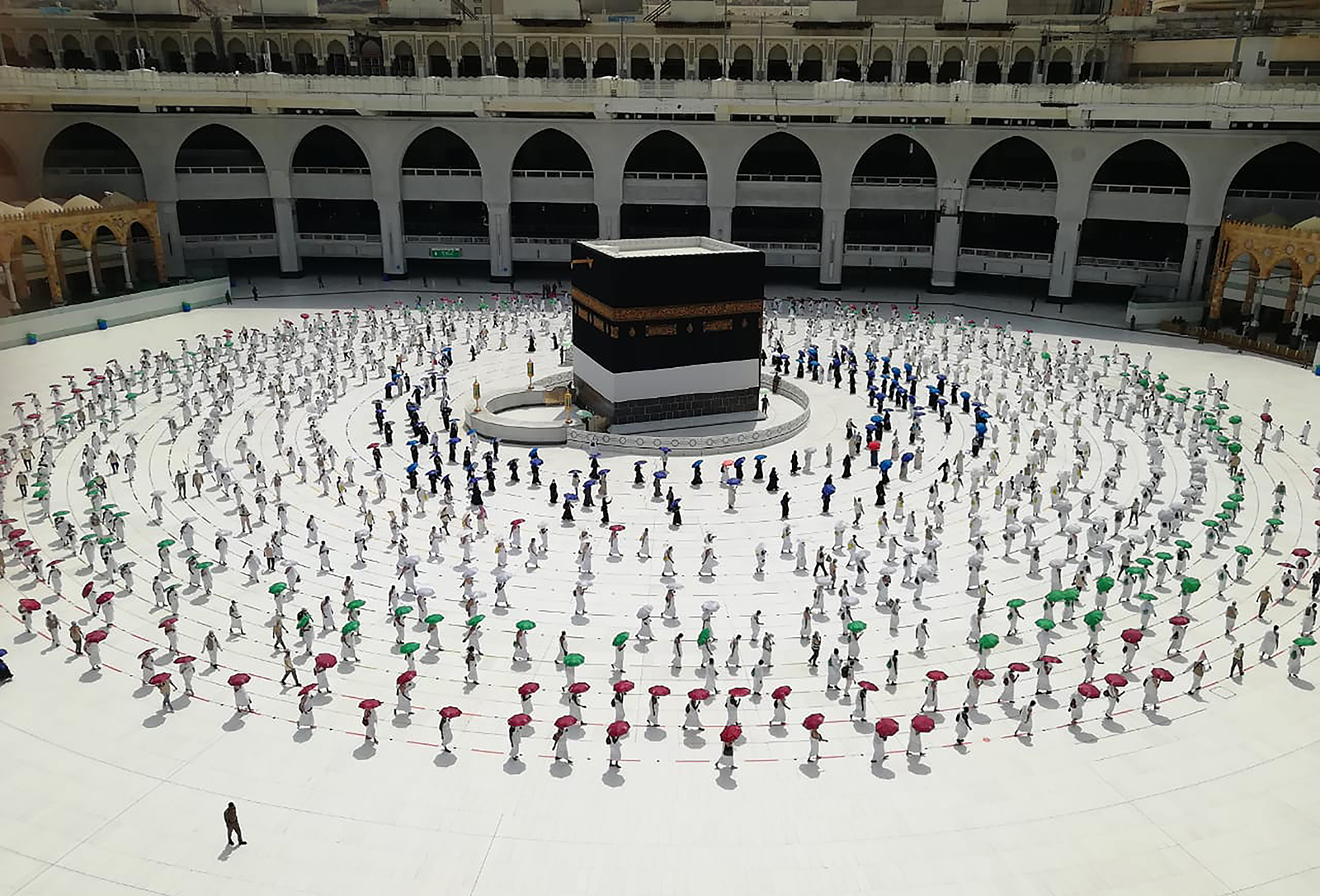 Hundreds of Muslim pilgrims circle the Kaaba, the cubic building at the Grand Mosque, as they observe social distancing to protect against the coronavirus, in the Muslim holy city of Mecca, Saudi Arabia, on July 29, 2020. During the first rites of hajj, Muslims circle the Kaaba counter-clockwise seven times while reciting supplications to God, then walk between two hills where Ibrahim's wife, Hagar, is believed to have run as she searched for water for her dying son before God brought forth a well that runs to this day. (AP Photo)
