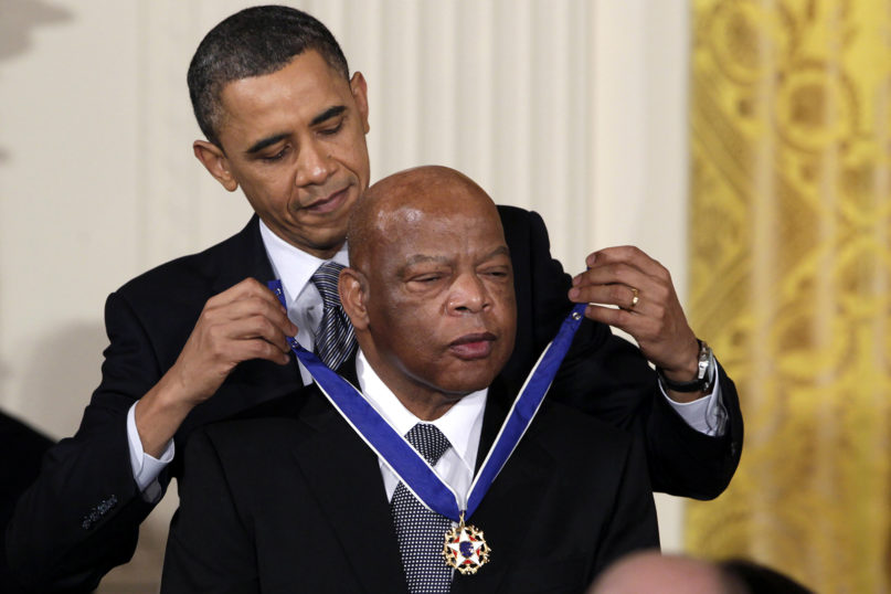 In this Feb. 15, 2011, file photo, President Barack Obama presents a 2010 Presidential Medal of Freedom to U.S. Rep. John Lewis, D-Georgia, during a ceremony in the East Room of the White House in Washington. Lewis, who carried the struggle against racial discrimination from Southern battlegrounds of the 1960s to the halls of Congress, died July 17, 2020. (AP Photo/Carolyn Kaster, File)
