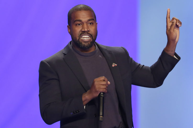 Kanye West answers questions from pastor Joel Osteen during a service at Lakewood Church, in Houston, on Nov. 17, 2019. (AP Photo/Michael Wyke)