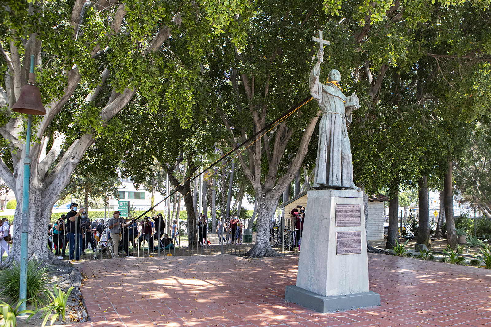 Demonstrators prepare to pull down a Junipero Serra statue on June 20, 2020, in downtown Los Angeles at Father Serra Park. Photo by Erick Iñiguez