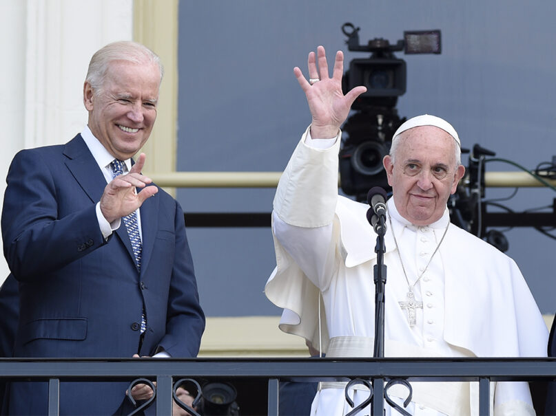 Pope Francis, right, and then-Vice President Joe Biden wave to the crowd on Capitol Hill in Washington on Sept. 24, 2015, as they stand on the Speaker’s Balcony on Capitol Hill, after the pope addressed a joint meeting of Congress inside. (AP Photo/Susan Walsh)