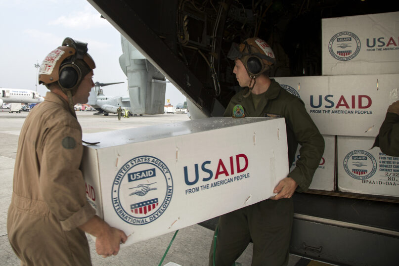 U.S. service members from Joint Task Force 505 load relief supplies from the United States Agency for International Development onto a U.S. Marine Corps MV-22 Osprey at Tribhuvan International Airport, Kathmandu, Nepal, May 17, 2015. (U.S. Marine Corps photo by MCIPAC Combat Camera Lance Cpl. Hernan Vidana/Creative Commons)