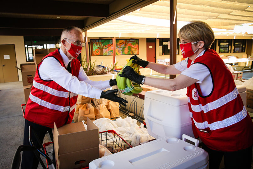 Commissioners Kenneth and Jolene Hodder pack food for the Salvation Army in Santa Barbara, Calif. Courtesy of the Salvation Army