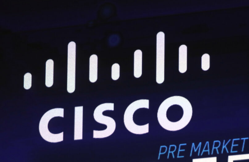 In this Oct. 3, 2018, file photo, the Cisco logo appears on a screen at the Nasdaq MarketSite in New York’s Times Square. California regulators sued Cisco Systems for discriminating against an engineer at the company’s headquarters because he is a Dalit Indian. (AP Photo/Richard Drew, File)