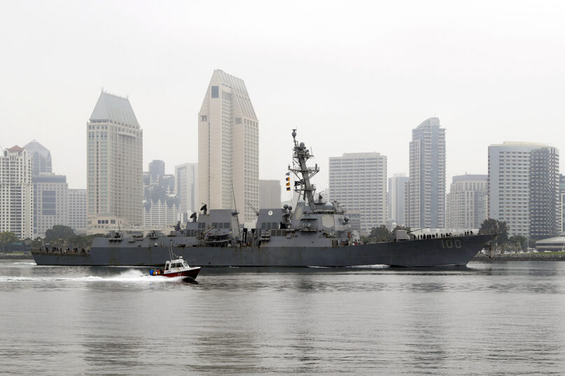 The USS Kidd passes downtown San Diego as it returns to Naval Base San Diego on April 28, 2020, seen from Coronado, California. (AP Photo/Gregory Bull)