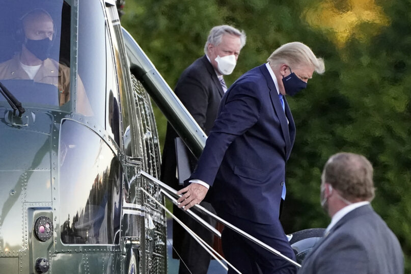 President Donald Trump arrives at Walter Reed National Military Medical Center, in Bethesda, Maryland, on Oct. 2, 2020, on Marine One helicopter after he tested positive for COVID-19. (AP Photo/Jacquelyn Martin)