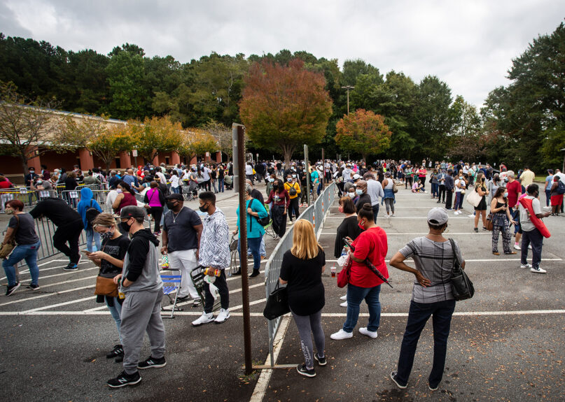 Hundreds of people wait in line for early voting in Marietta, Ga., on Oct. 12, 2020. (AP Photo/Ron Harris, File)