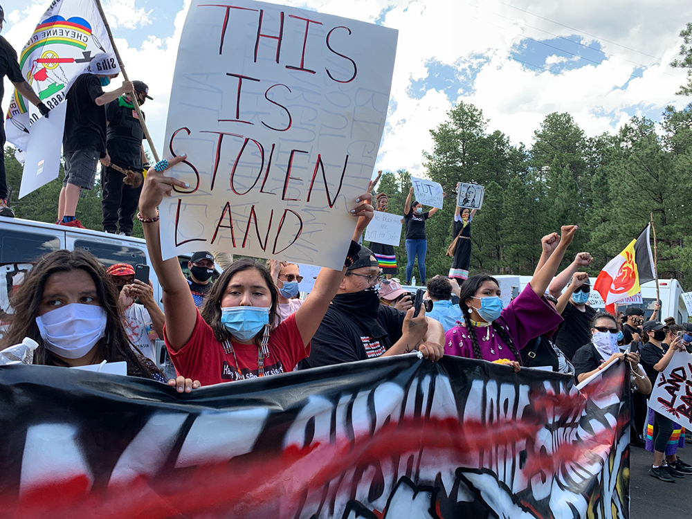 Native American protesters and supporters gather at the Black Hills, now the site of Mount Rushmore, on July 3, 2020 in Keystone, South Dakota. A multi-generational gathering, led by many young women and including different tribes, peacefully held the line. (Photo by Micah Garen/Getty Images)