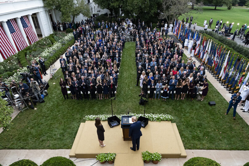 In this Sept. 26, 2020, photo, President Donald Trump, center, stands with Judge Amy Coney Barrett as they arrive for a news conference to announce Barrett as his nominee to the Supreme Court, in the Rose Garden at the White House in Washington. (AP Photo/Alex Brandon)