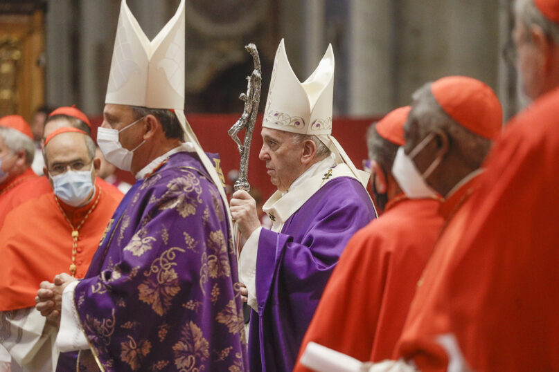 Pope Francis arrives to celebrate Mass the day after he raised 13 new cardinals to the highest rank in the Catholic hierarchy, at St. Peter's Basilica, Sunday, Nov. 29, 2020. (AP Photo/Gregorio Borgia, Pool)