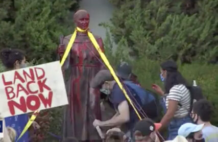 People deface and tear down a statue of Junipero Serra in San Rafael, California, on Oct. 12, 2020. Video screen grab via KTVU