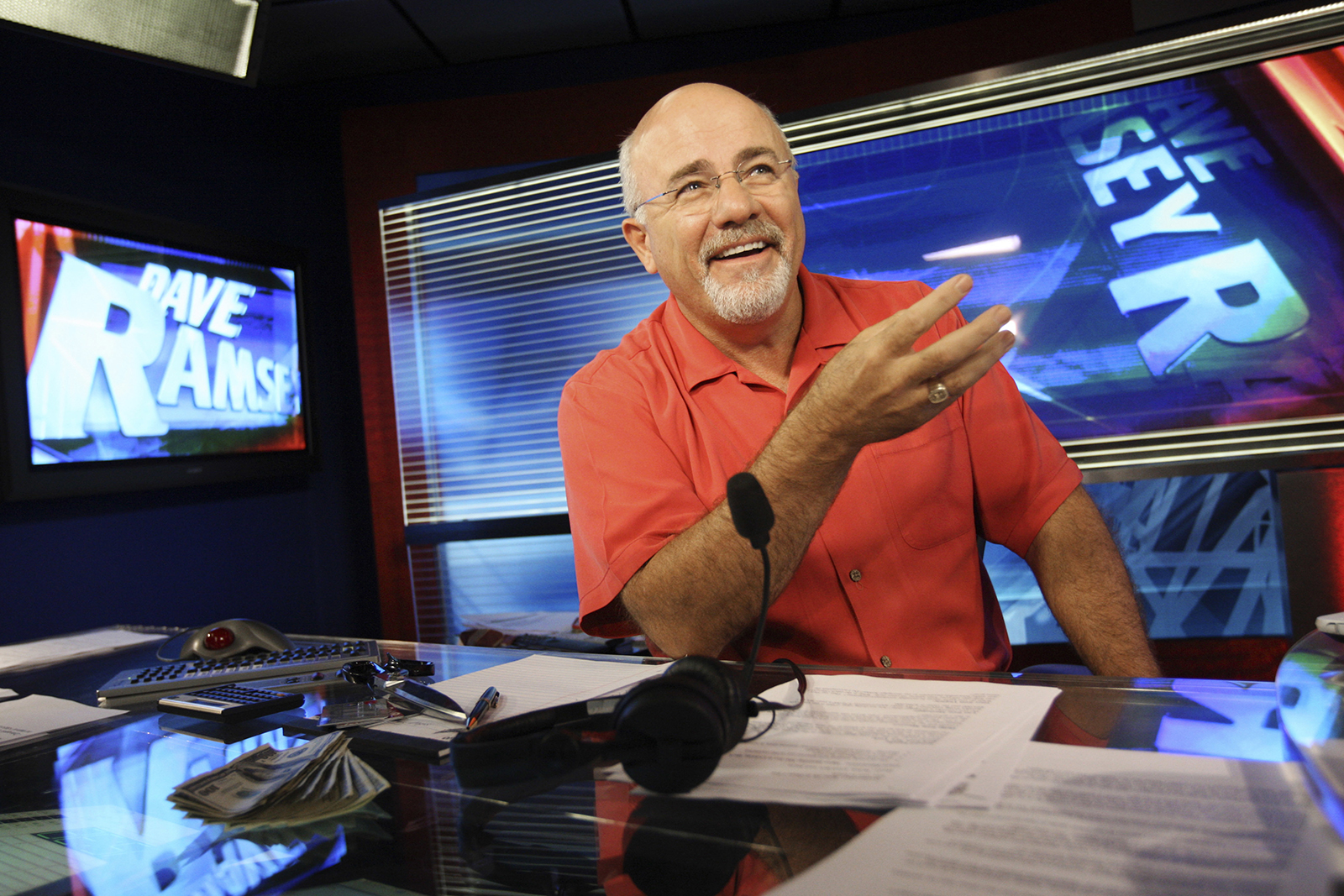 In this July 29, 2009, file photo, financial guru Dave Ramsey sits in his broadcasting studio in Brentwood, Tennessee. (AP Photo/Josh Anderson, File)