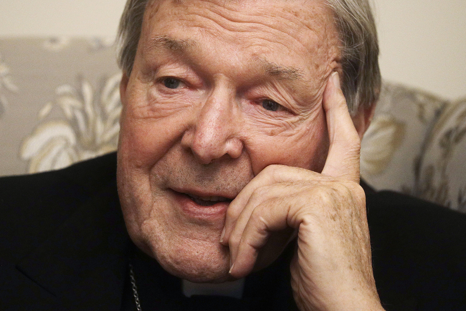 Cardinal George Pell answers a journalist’s question during an interview with The Associated Press inside his residence near the Vatican in Rome on Nov. 30, 2020. The pope’s former treasurer, who was convicted and then acquitted of sexual abuse in his native Australia, said he feels a dismayed sense of vindication as the financial mismanagement he tried to uncover in the Holy See is now being exposed in a spiraling Vatican corruption investigation. (AP Photo/Gregorio Borgia)