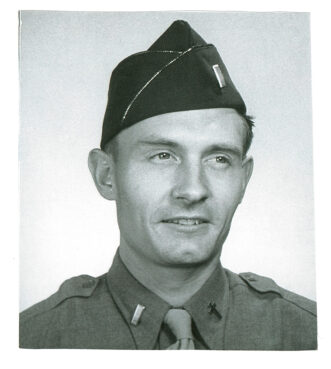 The Rev. Emil Kapaun in his trademark garrison hat that he wore on his rounds in Camp No. 5, a brutal prison in the waterfront town of Pyoktong, North Korea. He died there at the age of thirty-five. Photo courtesy of the Father Kapaun Guild