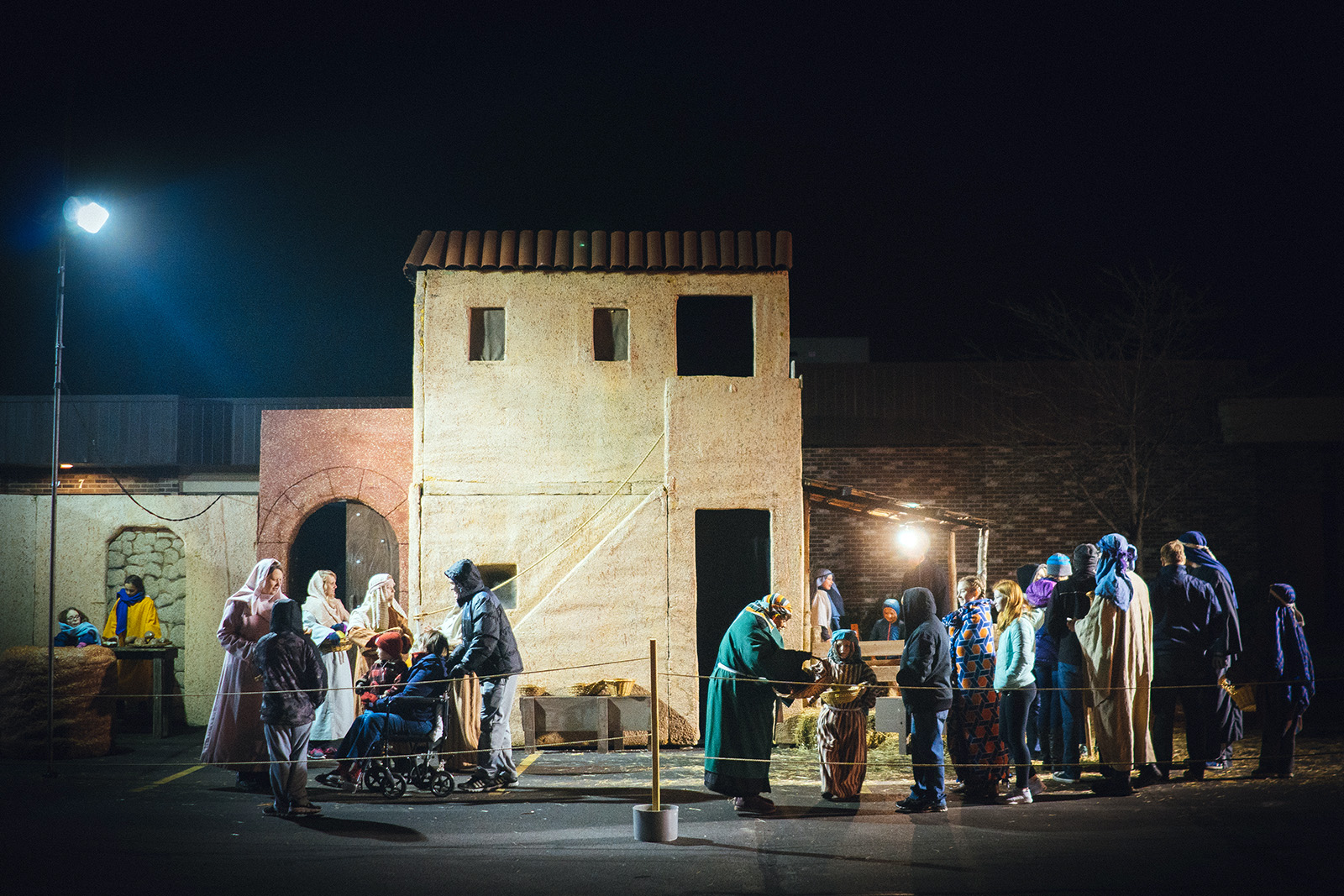 Walk-through guests interact with the cast at the Bethlehem market during the 2015 Lafayette Living Nativity, which is hosted by Faith Church of Lafayette, Indiana. Photo courtesy of Faith Ministries