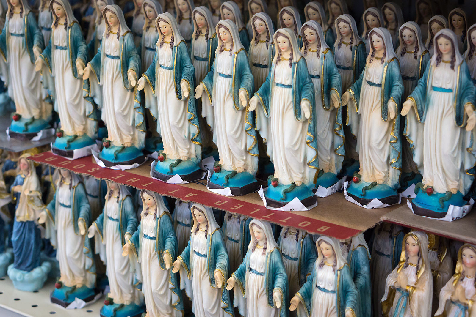 Statuettes of the Virgin Mary on display. Photo by Thom Masat/Unsplash/Creative Commons