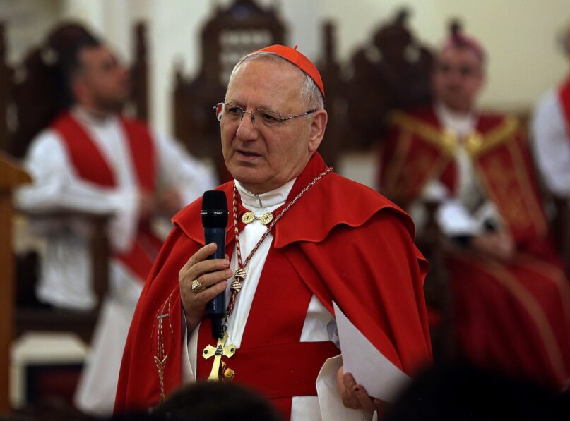 FILE - in this Sunday, April 14, 2019 file photo, Cardinal Louis Raphael I Sako addresses the faithful during the Palm Sunday service at Mar Youssif Church in Baghdad, Iraq. Iraq’s top Catholic official said Thursday, Jan. 28, 2021 that a deadly suicide bombing in Baghdad hasn’t thwarted Pope Francis’ plans to visit, and he confirmed the pontiff would meet with the country’s top Shiite cleric, Ali al-Sistani, in a significant highlight of the first-ever papal trip to Iraq. The Chaldean patriarch, Cardinal Louis Raphael Sako, provided the first details of Francis’ March 5-8 itinerary during a virtual press conference hosted by the French bishops' conference. (AP Photo/Hadi Mizban, File)