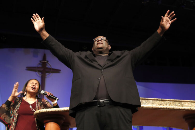 In this June 7, 2020, file photo, Dwight McKissic, pastor of Cornerstone Baptist Church, and his wife, Vera McKissic, pray during services in Arlington, Texas. As a student in college and seminary, then as a pastor in Texas, McKissic has been affiliated with the Southern Baptist Convention for more than 45 years. Now he’s pondering whether he and his congregation should break away -- following the steps of several other Black pastors who exited in dismay over race-related actions of some white SBC leaders.  (AP Photo/LM Otero, File)