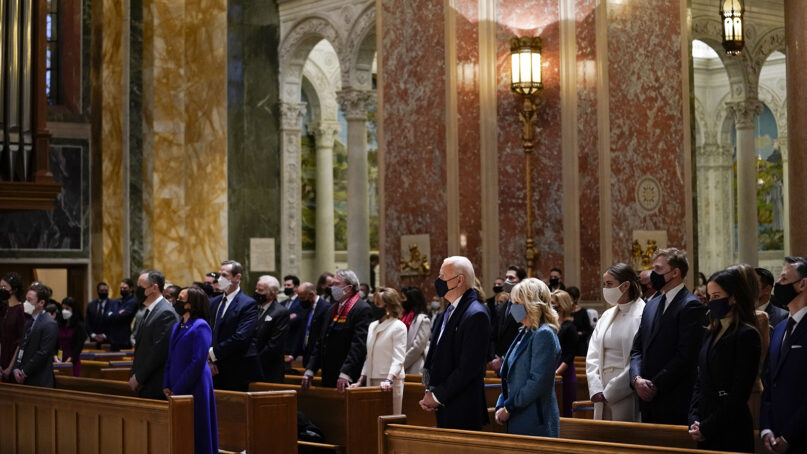 President-elect Joe Biden, center, and his wife, Jill Biden, attend Mass at the Cathedral of St. Matthew the Apostle during Inauguration Day ceremonies Jan. 20, 2021, in Washington. (AP Photo/Evan Vucci)