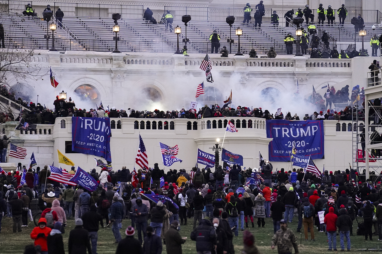 Violent protesters, loyal to President Donald Trump, storm the Capitol, Wednesday, Jan. 6, 2021, in Washington. (AP Photo/John Minchillo)