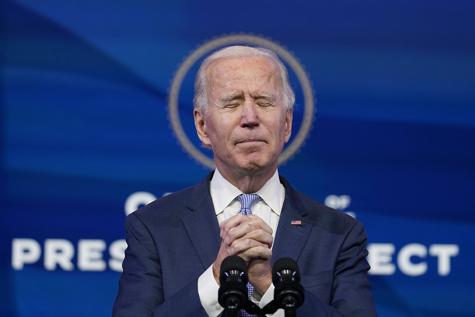 President-elect Joe Biden prays during an address from The Queen theater in Wilmington, Del., Wednesday, Jan. 6, 2021. (AP Photo/Susan Walsh)