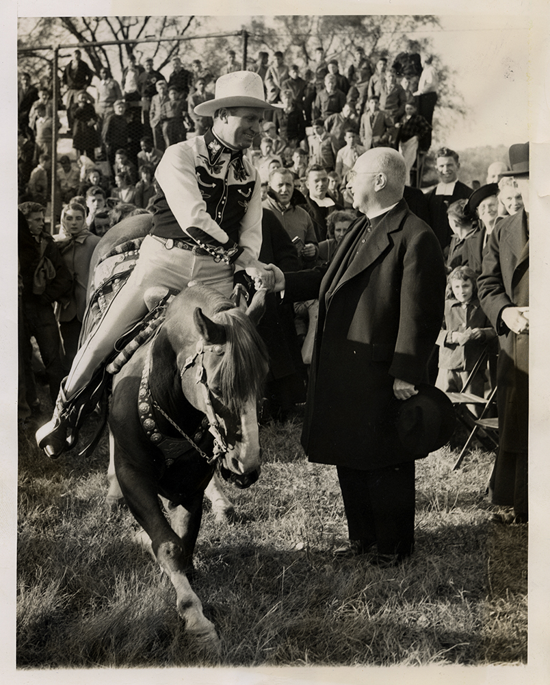 Gene Autry and his famous mount, Champion, salute Francis Cardinal Spellman, Archbishop of New York, during a visit at Lincoln Hall, a Catholic home and farm school for boys, in Lincolndale, New York, in 1948. The cowboy and a few other members of a rodeo in New York City performed for the boys at the camp. RNS archive photo. Photo courtesy of the Presbyterian Historical Society