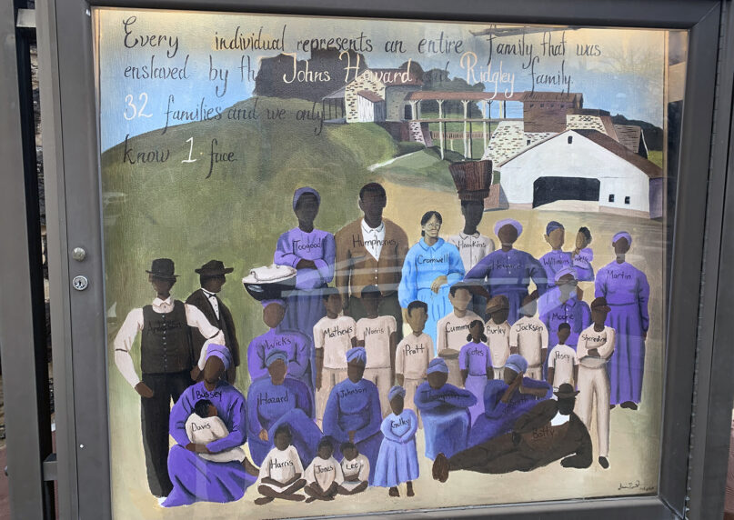 “Tribute,” by Dez Thaniel, is a commissioned work representing the families enslaved by the Howard and Johns families, the founding rectors of Memorial Episcopal Church. Hattie Cromwell, center, the only face with detail, is a great-grandmother of the Rev. Natalie Conway, Memorial’s deacon. The artwork is displayed in front of Memorial Episcopal Church in Baltimore. Courtesy photo by Grey Maggiano
