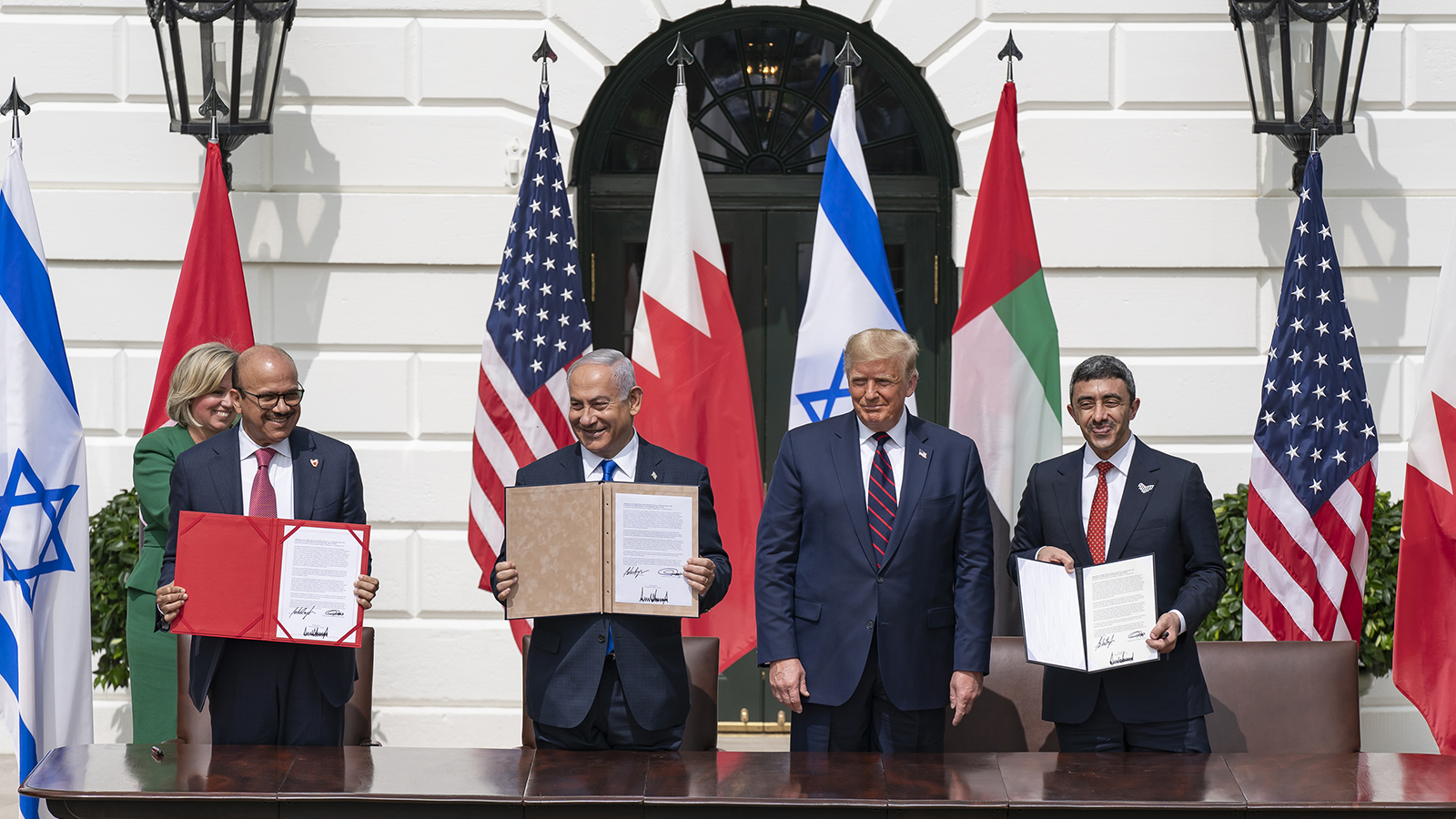 Minister of Foreign Affairs of Bahrain Dr. Abdullatif bin Rashid Al-Zayani, from left, Israeli Prime Minister Benjamin Netanyahu, U.S. President Donald Trump and Minister of Foreign Affairs for the United Arab Emirates Abdullah bin Zayed Al Nahyan display signatures after signing the Abraham Accords, Tuesday, Sept. 15, 2020, on the South Lawn of the White House. (Official White House Photo by Shealah Craighead/Creative Commons)