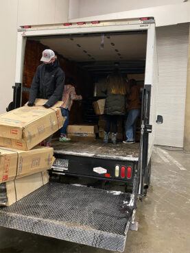 Cots are unloaded for an emergency warming center at Kay Bailey Hutchison Convention Center in Dallas, Monday, Feb. 15, 2021. Photo courtesy of Ali Hendricksen/OurCalling