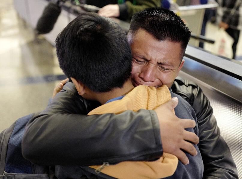 David Xol-Cholom of Guatemala hugs his son Byron at Los Angeles International Airport as they reunite, after being separated for roughly one and a half years, during the Trump administration’s wide-scale separation of immigrant families, Jan. 22, 2020, in Los Angeles. (AP Photo/Ringo H.W. Chiu)