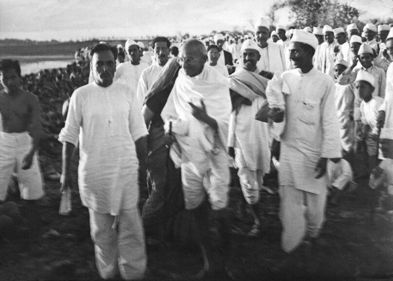 Mahatma Gandhi gives the last instructions on the beach near Dandi, India, as he and his supporters get ready to demonstrate at the Salt Satyagraha (Salt March) in which he and demonstrators marched 241 miles to the sea to make their own salt, April 6, 1930. Britain responded by arresting over 60,000 people. (AP Photo/Deutscher Photo Dienst/W. Bossard)