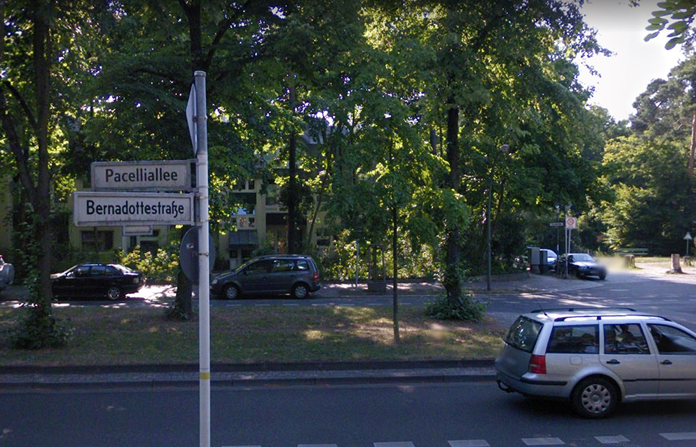A car crosses an intersection along the Pacelliallee, a tree-lined boulevard in western Berlin. Image via Google Maps