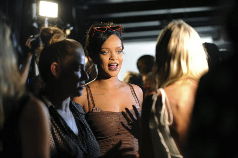 Rihanna talks to media backstage after Savage x Fenty fashions were shown in a performance at the Brooklyn Navy Yard at the end of Fashion Week, Wednesday Sept. 12, 2018, in the Brooklyn borough of New York. (AP Photo/Diane Bondareff)