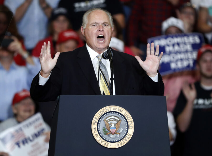 This Nov. 5, 2018, file photo shows radio personality Rush Limbaugh introducing President Donald Trump at the start of a campaign rally in Cape Girardeau, Missouri. Limbaugh, the talk radio host who became the voice of American conservatism, has died.  (AP Photo/Jeff Roberson, File)