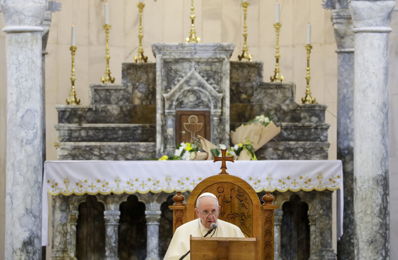FILE - Pope Francis delivers his speech during a meeting with the Qaraqosh community at the Church of the Immaculate Conception, in Qaraqosh, Iraq, Sunday, March 7, 2021.   The story of Doha Sabah Abdallah, who’s son’s death alerted an entire Christian village in Iraq’s north of the impending militant onslaught, resonated deeply with Pope Francis during a recent historic papal visit.    But days after the pontiff’s departure from Iraq, after a whirlwind four-day country-wide trip to give hope and encourage the country’s diminishing ancient Christian community to remain and return, even Abdallah said given the chance she would immigrate elsewhere.   (AP Photo/Andrew Medichini, File)