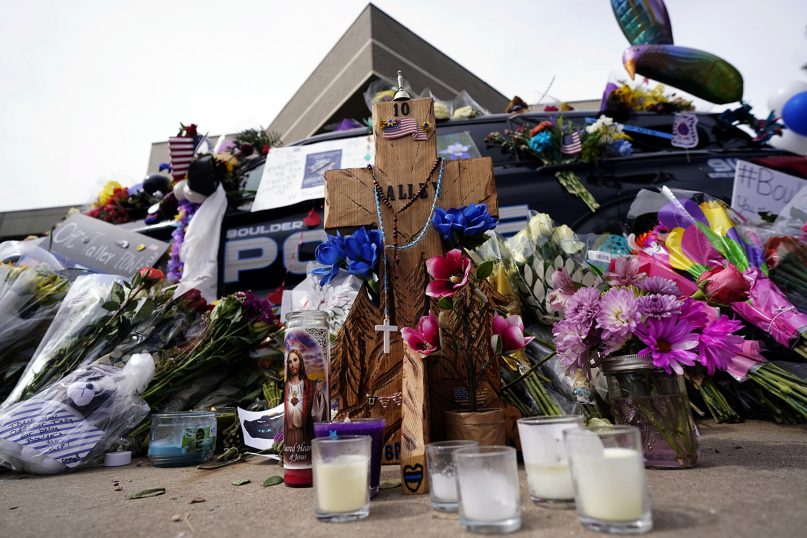 Tributes surround a police cruiser placed in honor of fallen officer Eric Talley outside the Boulder Police Department Thursday, March 25, 2021, in Boulder, Colo. Officer Talley and 9 others were killed in a shooting at a supermarket on Monday. (AP Photo/David Zalubowski)