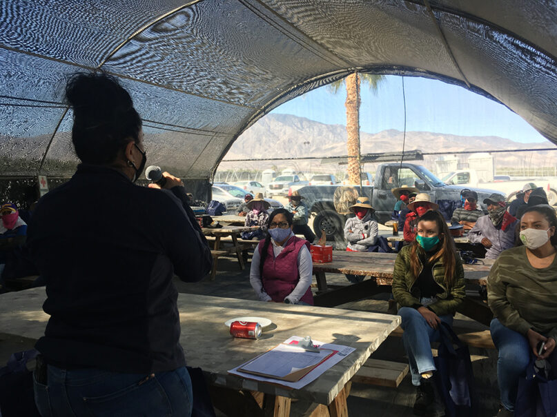 Luz Gallegos, left, executive director of TODEC Legal Center, holds a vaccine information workshop for agricultural workers, Thursday, March 18, 2021, in Thermal, California. RNS photo by Alejandra Molina