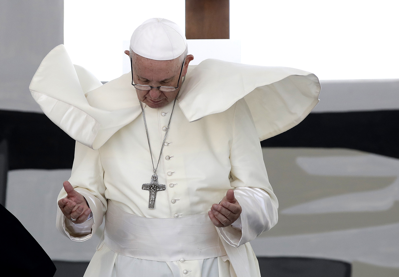 A gust of wind blows Pope Francis' cape as he prays for peace in the Middle East with an unprecedented gathering of Orthodox patriarchs and Catholic leaders in Bari, southern Italy, Saturday, July 7, 2018. (AP Photo/Alessandra Tarantino)