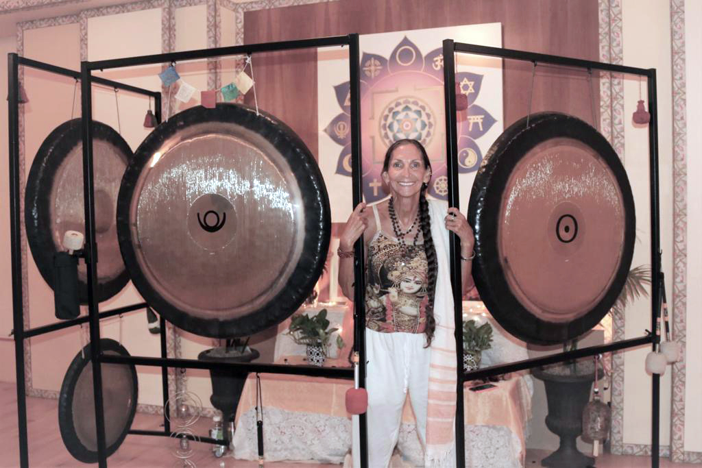 The Rev. Lakshmi Scalise with gongs at the Integral Yoga Institute in New York. Photo courtesy Integral Yoga Institute