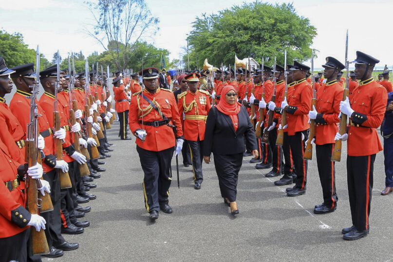 Tanzania's new president, Samia Suluhu Hassan, center right, inspects the guard of honor after being sworn in at a ceremony at State House in Dar es Salaam, Tanzania Friday, March 19, 2021. Samia Suluhu Hassan made history Friday when she was sworn in as Tanzania's first female president, following the death of her predecessor, John Magufuli. (AP Photo)