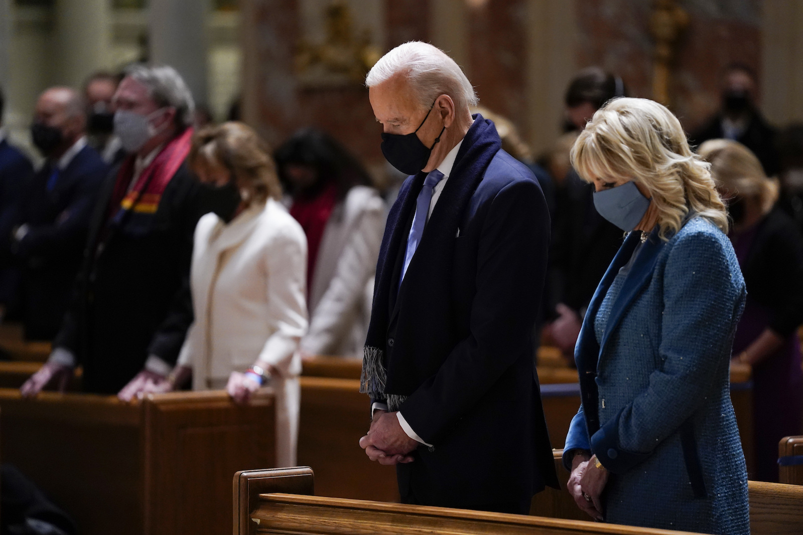 In this Jan. 20, 2021, file photo, President-elect Joe Biden and his wife, Jill Biden, attend Mass at the Cathedral of St. Matthew the Apostle during Inauguration Day ceremonies in Washington. (AP Photo/Evan Vucci)