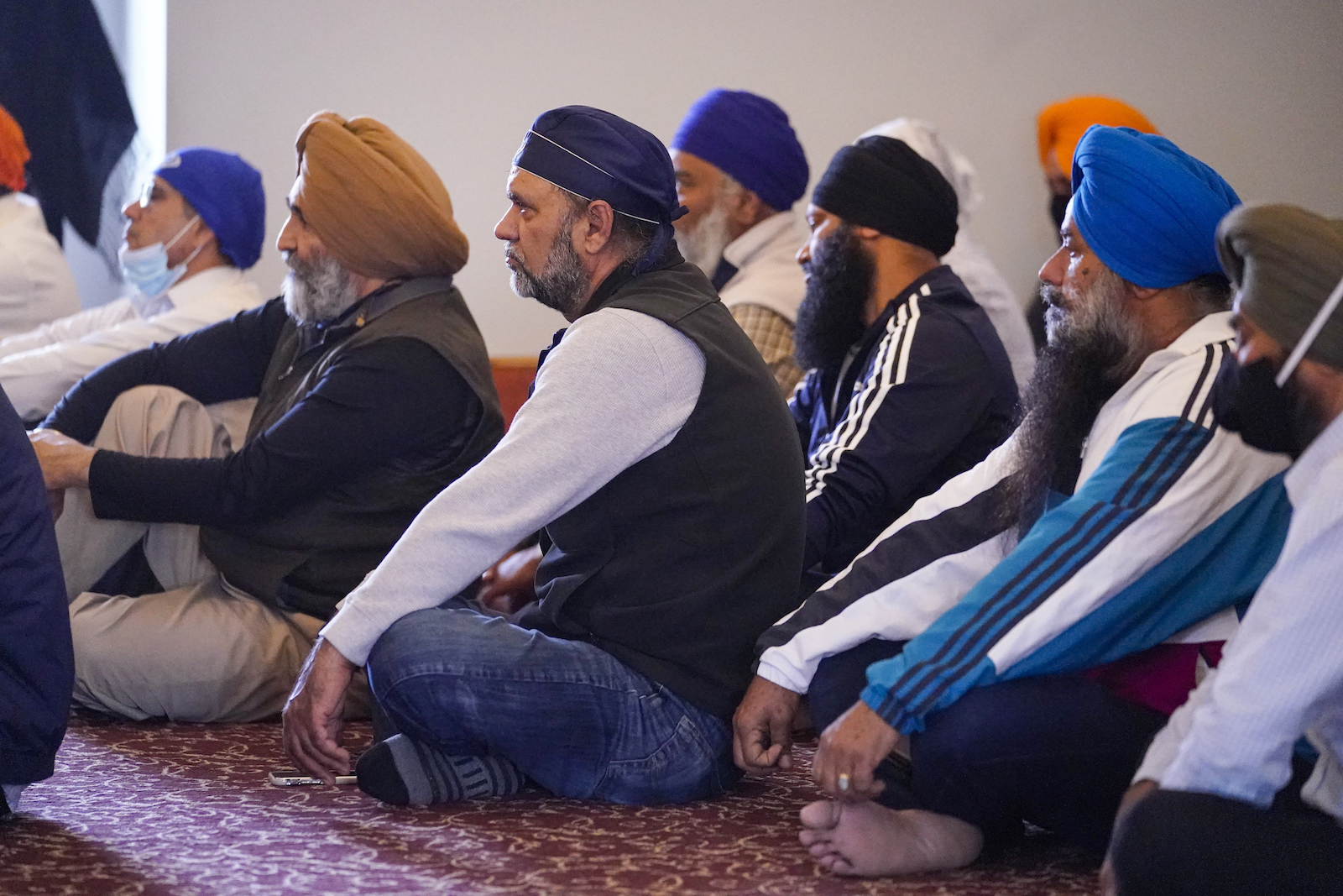Members of the Sikh Coalition gather at the Sikh Satsang of Indianapolis in Indianapolis, Saturday, April 17, 2021 to formulate the groups response to the shooting at a FedEx facility in Indianapolis that claimed the lives of four members of the Sikh community. A gunman killed eight people and wounded several others before apparently taking his own life in a late-night attack at a FedEx facility near the Indianapolis airport, police said, in the latest in a spate of mass shootings in the United States after a relative lull during the pandemic. (AP Photo/Michael Conroy)