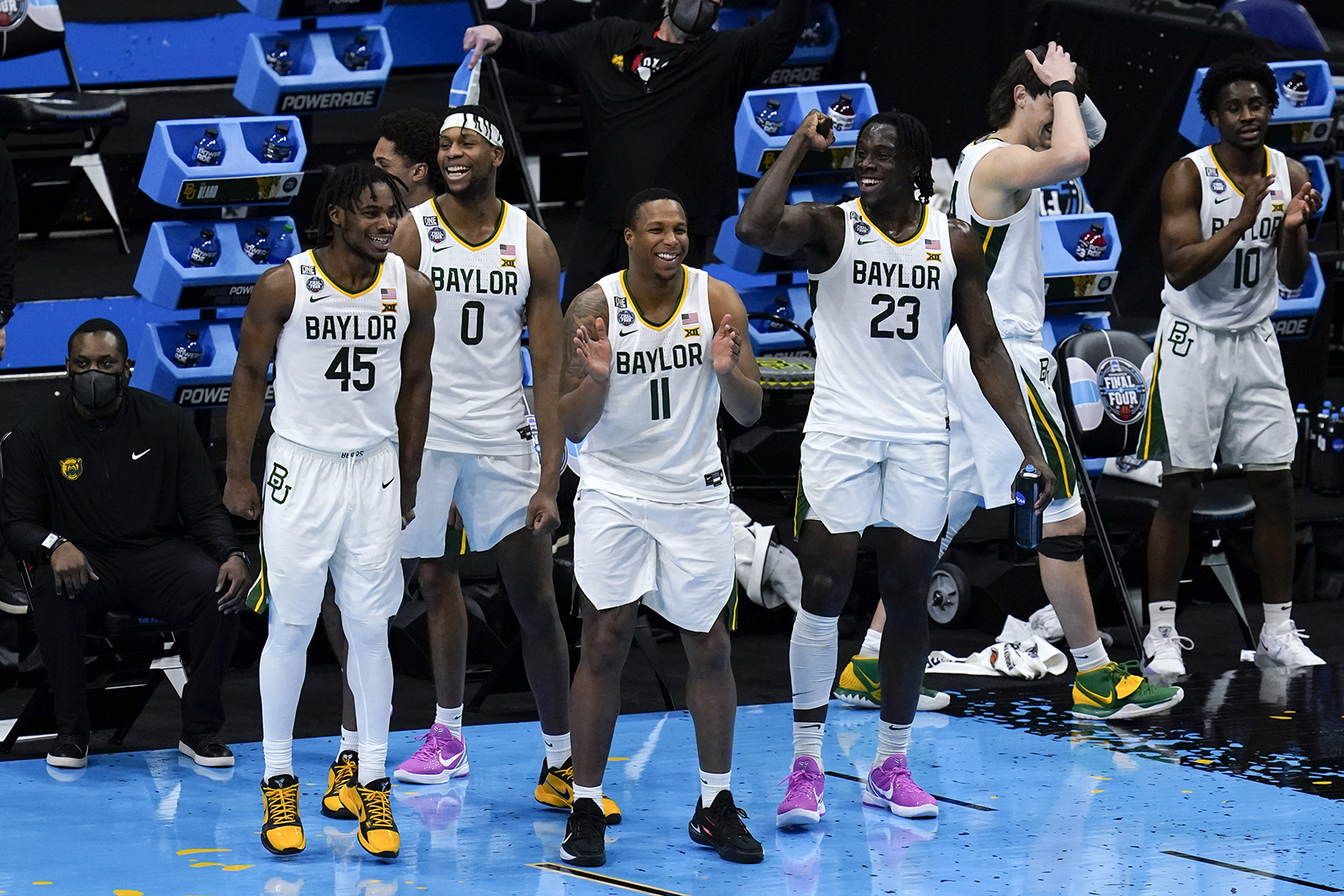 Baylor players celebrate at the end of a men's Final Four NCAA college basketball tournament semifinal game against Houston, Saturday, April 3, 2021, at Lucas Oil Stadium in Indianapolis. Baylor won 78-59. (AP Photo/Michael Conroy)