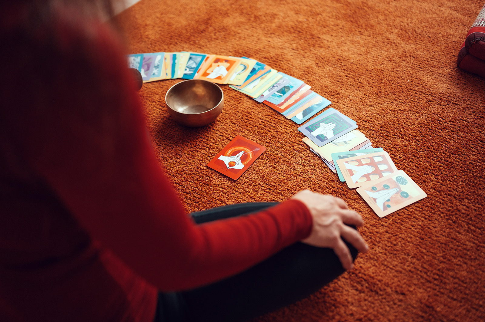 A woman reads her fortune via tarot cards. Photo by Conscious Design/Unsplash/Creative Commons