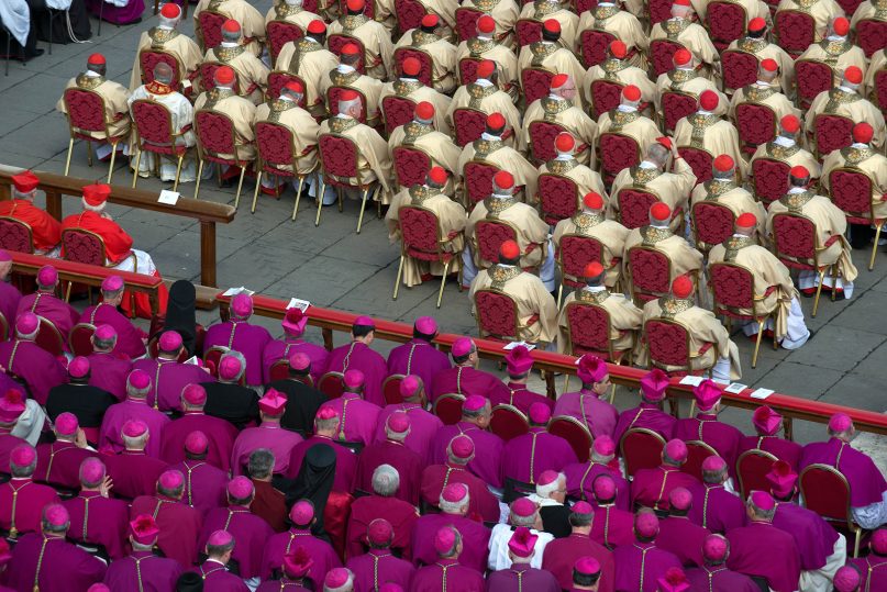 Catholic cardinals, top, and bishops, bottom, attend Pope Francis' grandiose inauguration Mass on Tuesday, March 19, 2013, in St. Peter's Square at the Vatican. RNS photo by Andrea Sabbadini