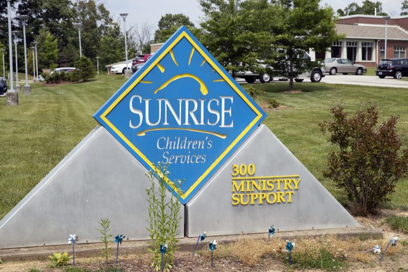 A sign for Sunrise Children's Services sits in front of the agency's Mount Washington, Ky., location on May 26, 2021. A cultural clash pitting religious beliefs against gay rights has jeopardized Kentucky's long-running relationship with a foster care and adoption agency affiliated with the Baptist church, Sunrise Children’s Services, which serves some of the state's most vulnerable children. (Brandon Porter/Kentucky Today via AP)