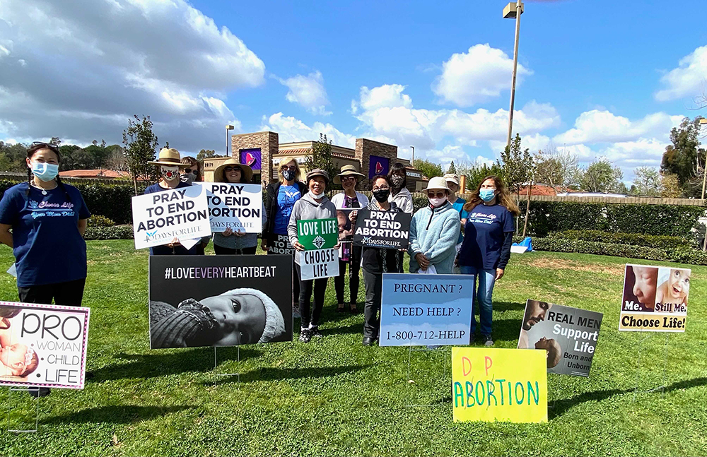 Lily Nguyen-Ellis, far left, with her fellow congregants outside a Planned Parenthood in Mission Viejo, California, where they pray for the end of abortion. Photo courtesy of Lily Nguyen-Ellis
