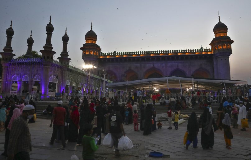Indian Muslims arrive to break their day-long fast during Ramadan at Mecca Masjid in Hyderabad, India, Thursday, May 6, 2021. Islam's holiest month of Ramadan is a period of intense prayer, dawn-to-dusk fasting and nightly feasts. (AP Photo /Mahesh Kumar A.)